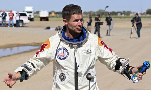 FILE - Felix Baumgartner of Austria gestures prior to speaking with the media after successfully jumping from a space capsule lifted by a helium balloon in Roswell