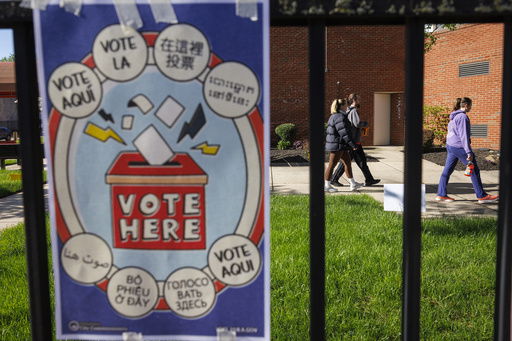 FILE - Voters in the 47th Ward arrive at the William B. Moore Manor apartments