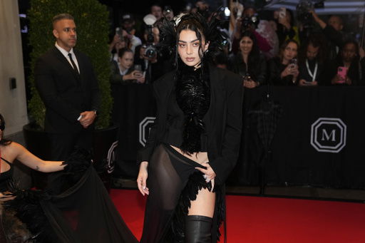 FILE - Charli xcx departs The Mark Hotel prior to attending The Metropolitan Museum of Art's Costume Institute benefit gala celebrating the opening of