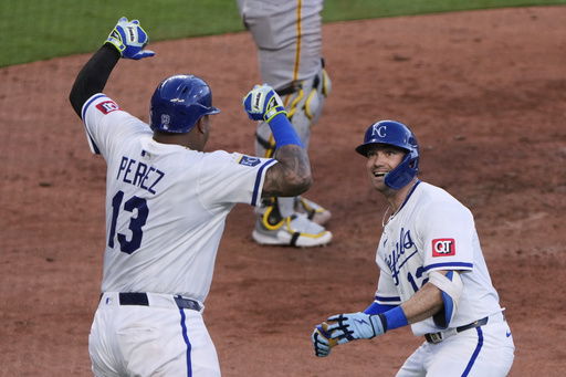 Kansas City Royals' Nick Loftin (12) celebrates with Salvador Perez (13) after hitting a two-run home run during the seventh inning of a baseball game against the Pittsburgh Pirates Tuesday