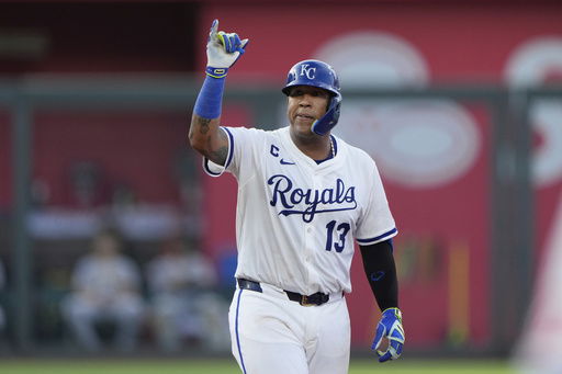 Kansas City Royals' Salvador Perez celebrates on second after hitting a one-run double during the third inning of a baseball game against the Pittsburgh Pirates