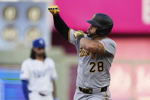 Pittsburgh Pirates' Tommy Pham celebrates as he rounds the bases after hitting a two-run home run during the third inning of a baseball game against the Kansas City Royals