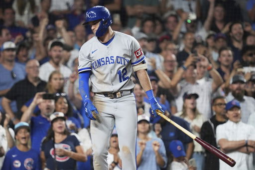 Kansas City Royals' Nick Loftin reacts after striking out swinging during the ninth inning of a baseball game against the Chicago Cubs in Chicago
