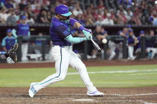 Arizona Diamondbacks' Randal Grichuk connects for an inside-the-park home run against the Kansas City Royals during the eighth inning of a baseball game Saturday