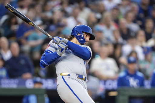 Kansas City Royals' Vinnie Pasquantino hits a two-run single during the seventh inning of a baseball game against the Seattle Mariners