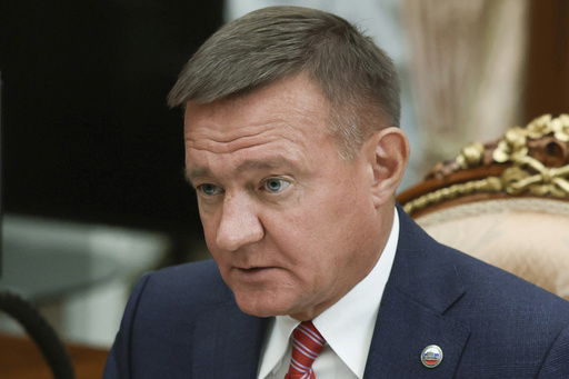 FILE - Transport Minister Roman Starovoit attends a meeting with Russian President Vladimir Putin at the Kremlin in Moscow