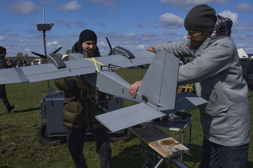 FILE - A manufacturer demonstrates a Ukrainian made drone at a Ukraine Defense Innovations exhibition for military clients on an undisclosed location in Ukraine
