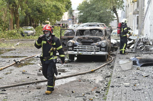 Firefighters work at the site of Russian air attack in Lviv