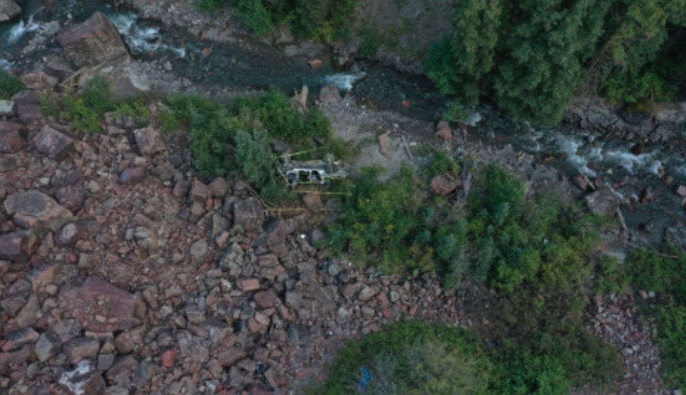 <i>Colorado State Patrol via CNN Newsource</i><br/>A tour company Jeep sits near Canyon Creek after traveling off a cliff on Camp Bird Road in September 2022. Three people were killed in the crash. The families of two women who were passengers in the tour are suing the driver's estate
