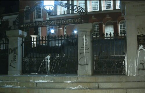 The entrance to the Massachusetts State House in Boston was vandalized early Wednesday morning and the bomb squad was later called in.