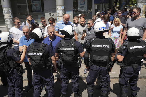 Serbian riot police officers guard intersection after remove street blockades that was set up as part of a protest after a massive rally demanding an early parliamentary election in Belgrade