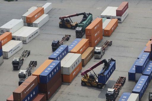 Cranes and shipping containers are seen at a port in Pyeongtaek
