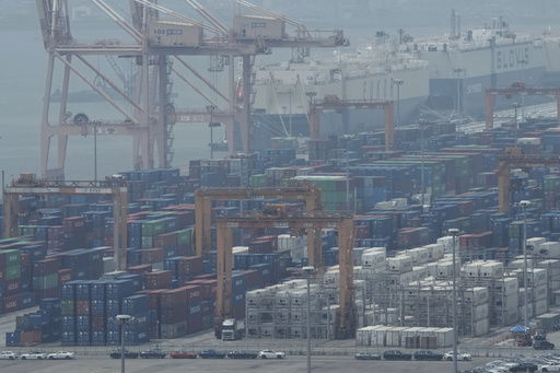 Cranes and shipping containers are seen at a port in Pyeongtaek