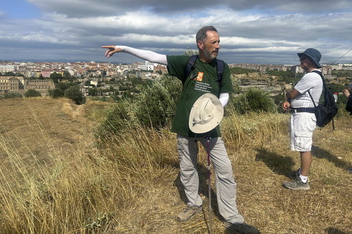 Jesuit Josep LluÌs Iriberri points toward Manresa