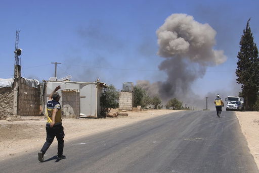 This photo provided by the Syrian Civil Defense White Helmets