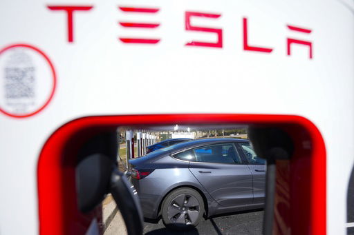 FILE - A Tesla level three Electric vehicle charger is visible
