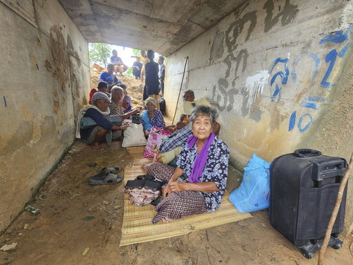 Thai people who fled clashes between Thai and Cambodian soldiers take shelter in Surin province