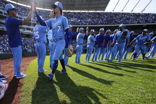 Kansas City Royals' Bobby Witt Jr. (7) celebrates with teammates after their baseball game against the Detroit Tigers