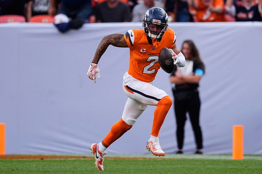 FILE - Denver Broncos cornerback Pat Surtain II (2) returns interception during the second half of an NFL football game