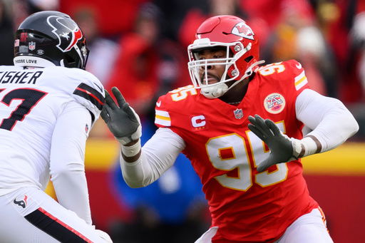 FILE - Kansas City Chiefs defensive tackle Chris Jones (95) rushes against Houston Texans offensive tackle Blake Fisher (57) during the first half of an NFL football divisional playoff game