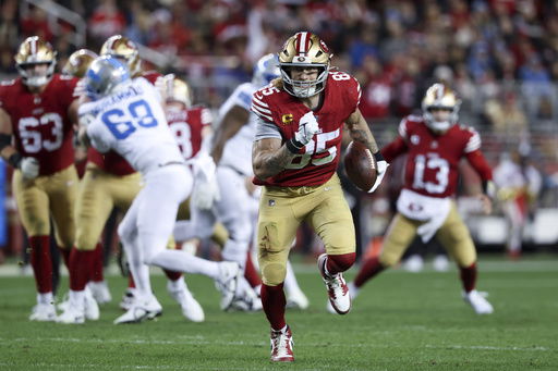 FILE - San Francisco 49ers tight end George Kittle (85) runs after a catch during the first half of an NFL football game against the Detroit Lions