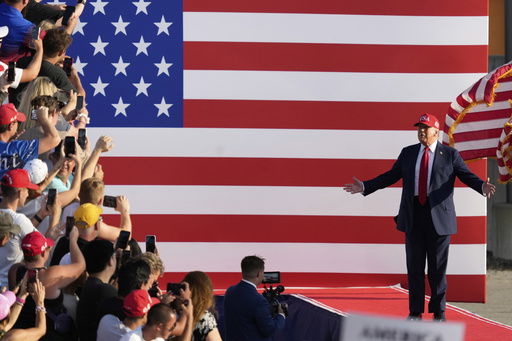 President Donald Trump arrives to speak at a rally at the Iowa State Fairgrounds