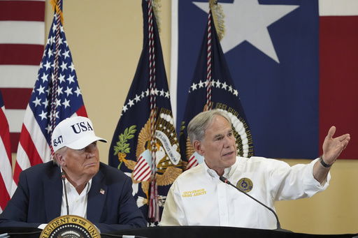 Texas Gov. Greg Abbott speaks as President Donald Trump listens during a roundtable discussion with first responders and local officials at Hill Country Youth Event Center in Kerrville