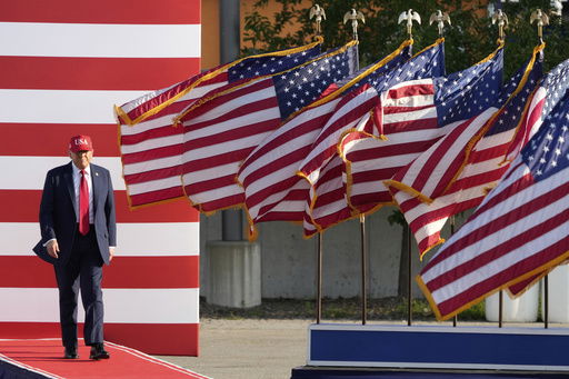 President Donald Trump arrives to speak at a rally at the Iowa State Fairgrounds