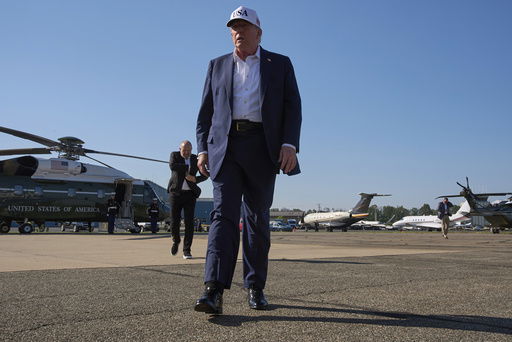 President Donald Trump walks toward the media to speak with them before boarding Air Force One