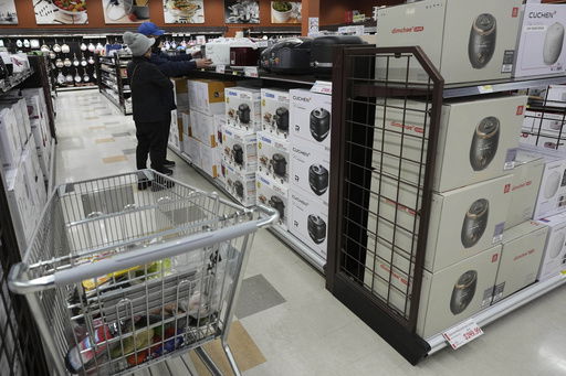 FILE - Shoppers shop electric rice cookers imported from Japan and Korea at the H Mart in Niles