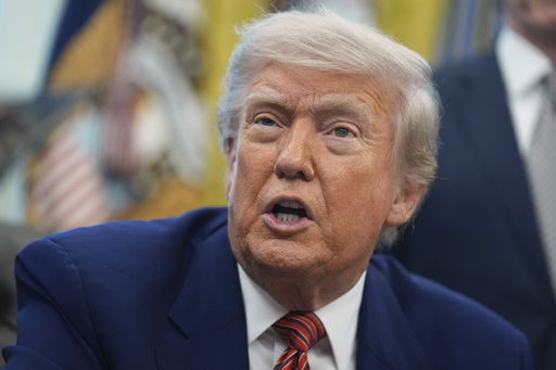FILE - President Donald Trump speaks to reporters in the Oval Office of the White House