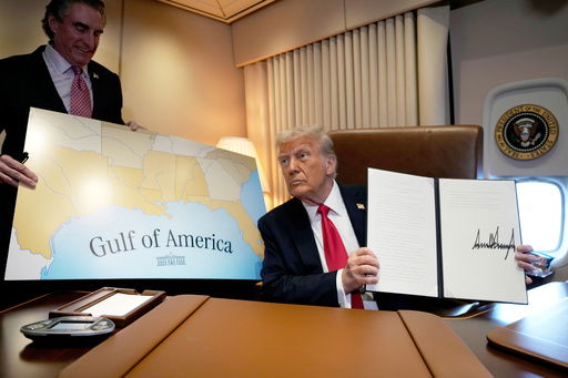 FILE - President Donald Trump holds up a signed proclamation declaring Feb. 9 Gulf of America Day