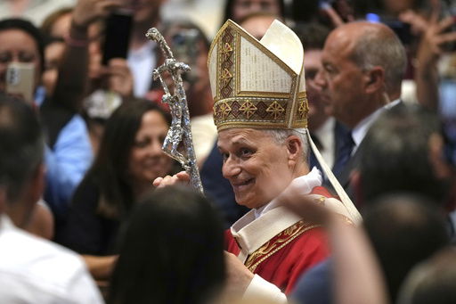 FILE - Pope Leo XIV leaves after celebrating a Mass in St. Peter's Basilica at the Vatican
