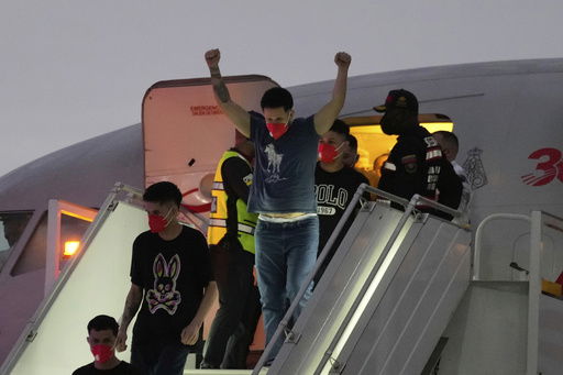 Migrants deported months ago by the United States to El Salvador under the Trump administration's immigration crackdown arrive at Simon Bolívar International Airport in Maiquetia