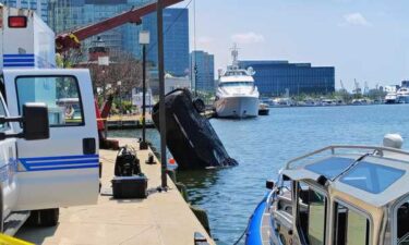 Baltimore police said the underwater recovery team received a notification about a possible submerged vehicle near East Pratt Street around 9:30 a.m. Once there
