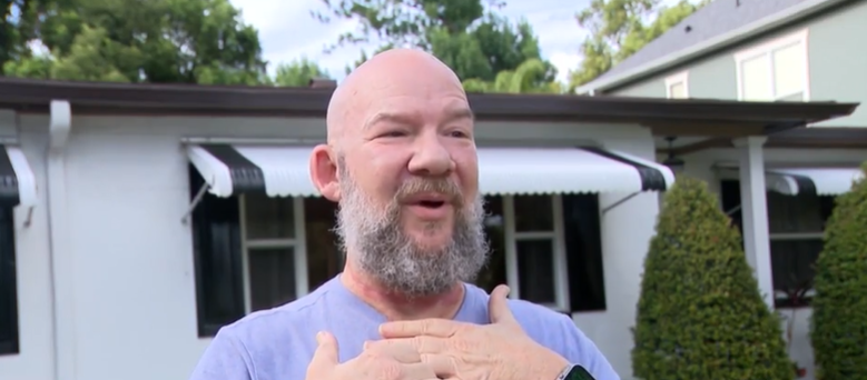 <i>WESH via CNN Newsource</i><br/>Mark Sunderland says a downed line on an Orlando Street wrapped around his neck and pulled him off his Vespa.