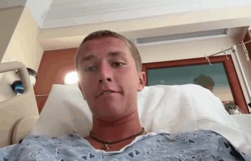 Sam Hollis said a shark grabbed him by the foot and yanked him off his board while he was at New Smyrna Beach.