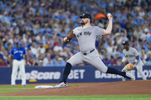 New York Yankees pitcher Carlos Rodon throws against the Toronto Blue Jays during first-inning baseball game action in Toronto