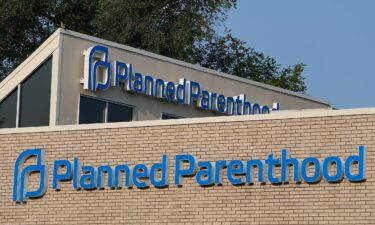 A Planned Parenthood sign is displayed on the outside of the clinic in Indianapolis in August 2023. Planned Parenthood is suing the Trump administration over the “big beautiful bill.”