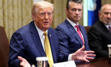 President Donald Trump speaks next to Defense Secretary Pete Hegseth during a Cabinet meeting at the White House in Washington