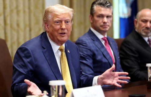 President Donald Trump speaks next to Defense Secretary Pete Hegseth during a Cabinet meeting at the White House in Washington