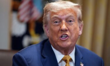 President Donald Trump speaks to members of the press during a Cabinet Meeting at the White House on July 8.