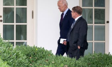 President Joe Biden speaks with White House Physician Kevin O'Connor as he arrives back at the White House in Washington