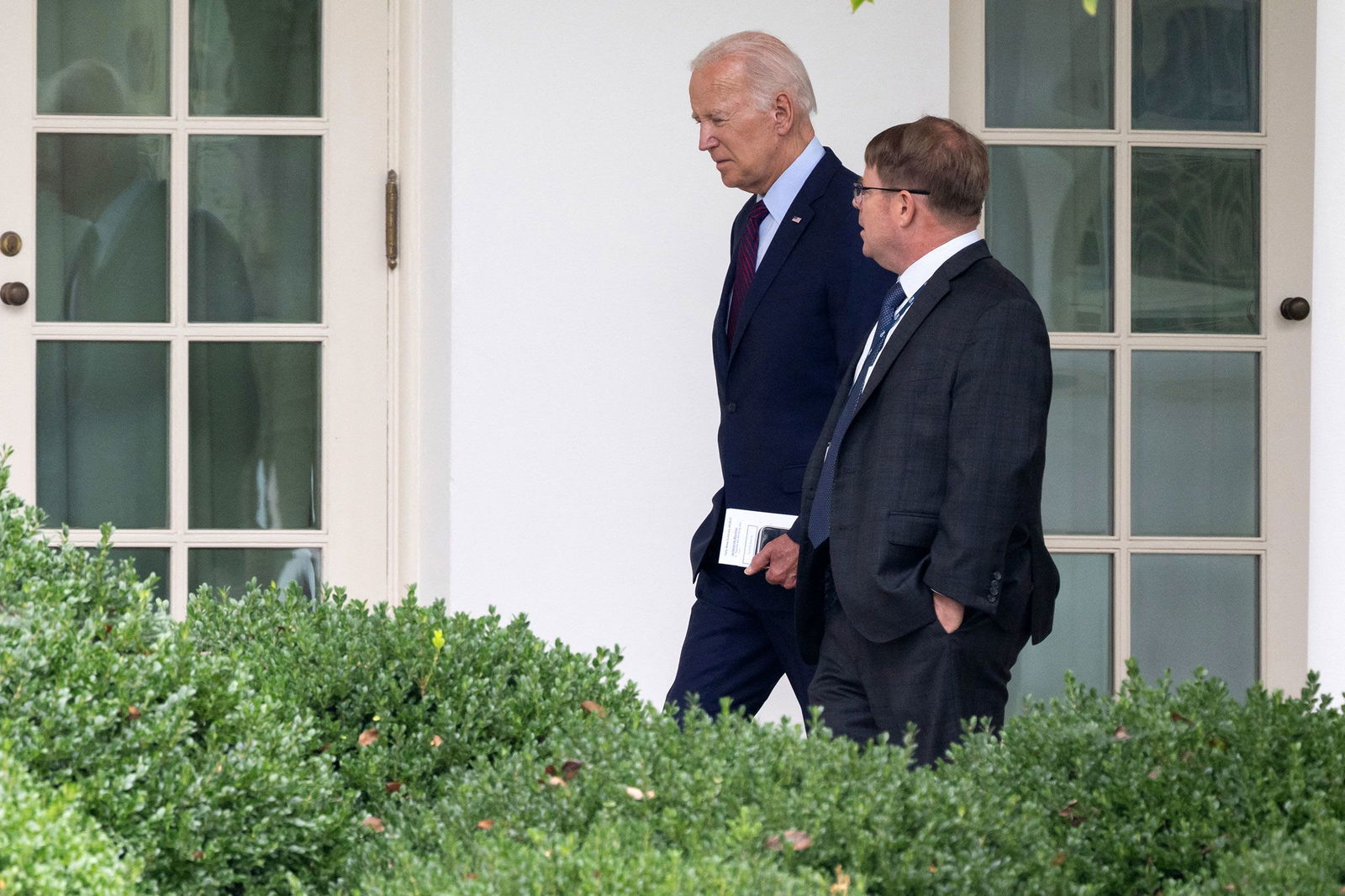 <i>Saul Loeb/AFP/Getty Images via CNN Newsource</i><br/>President Joe Biden speaks with White House Physician Kevin O'Connor as he arrives back at the White House in Washington