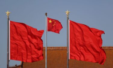 Chinese national flags flutter at Tiananmen square ahead of the annual two sessions in February 2024 in Beijing