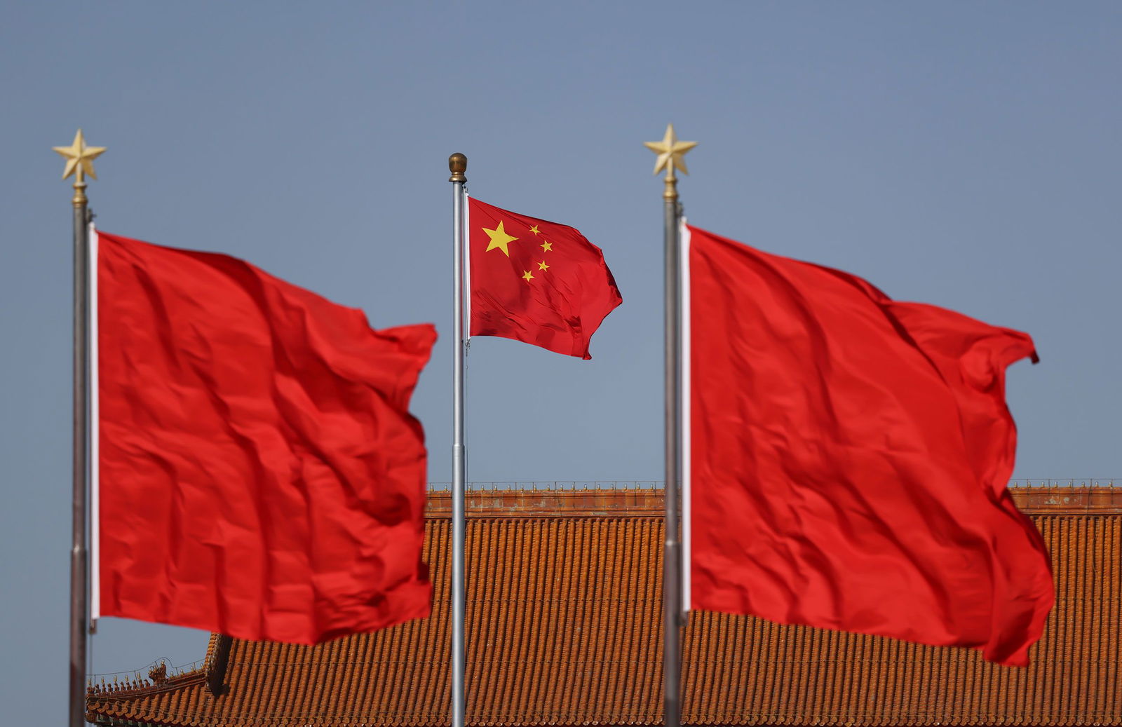 <i>VCG/Getty Images via CNN Newsource</i><br/>Chinese national flags flutter at Tiananmen square ahead of the annual two sessions in February 2024 in Beijing