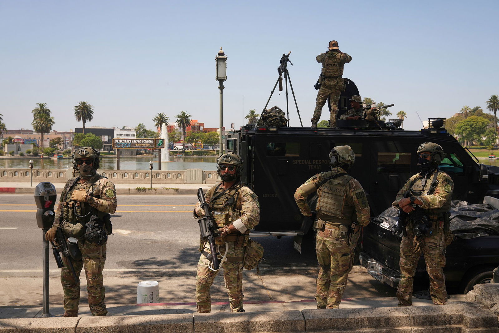 <i>Damian Dovarganes/AP/File via CNN Newsource</i><br/>Federal agents stage at MacArthur Park in Los Angeles on July 7