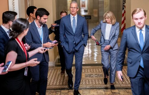Senate Majority Leader John Thune and Sen. Lisa Murkowski (R-AK) walk to the US Senate floor