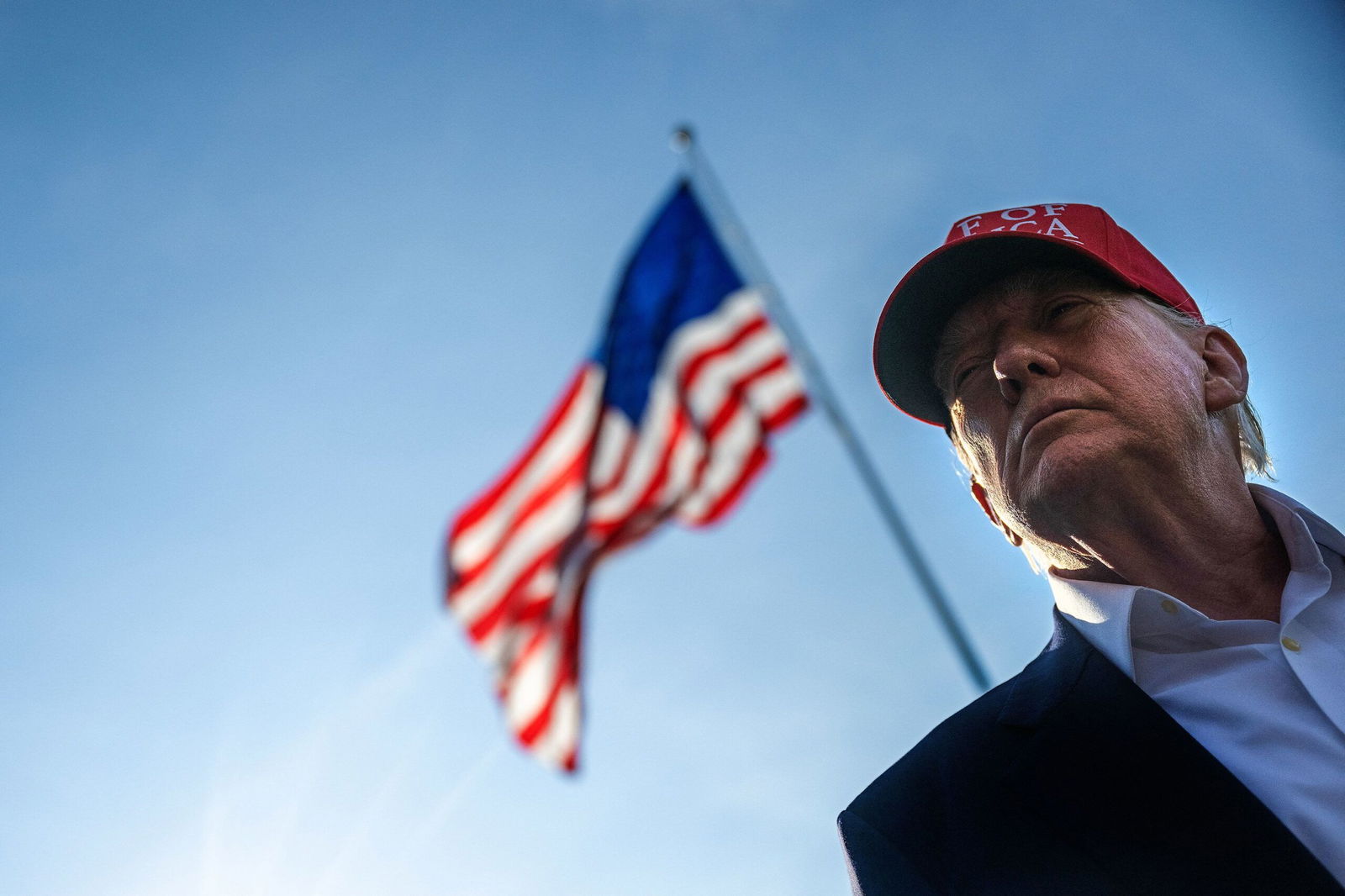 <i>Jim Watson/AFP/Getty Images via CNN Newsource</i><br/>US President Donald Trump talks to members of the press as he departs from the South Lawn of the White House in Washington