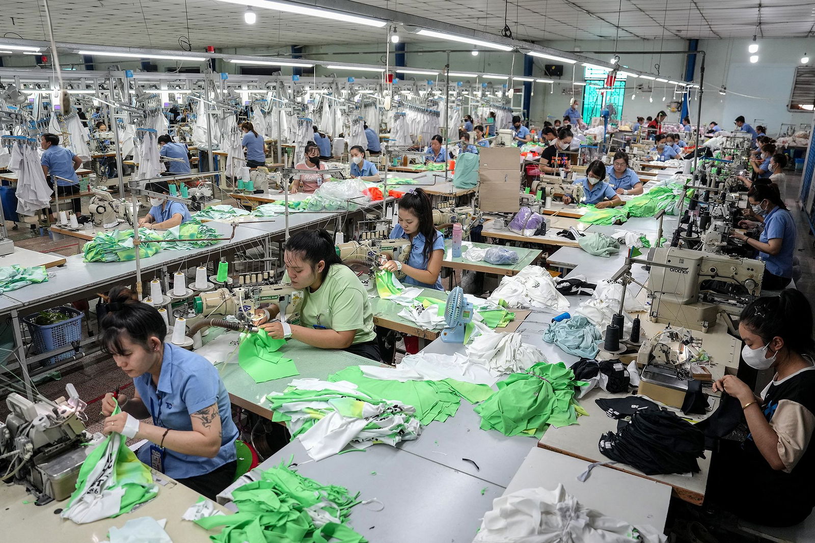 <i>Huu Kha/AFP/Getty Images via CNN Newsource</i><br/>Vietnamese garment factory workers stitch apparel at a factory in Ho Chi Minh City.